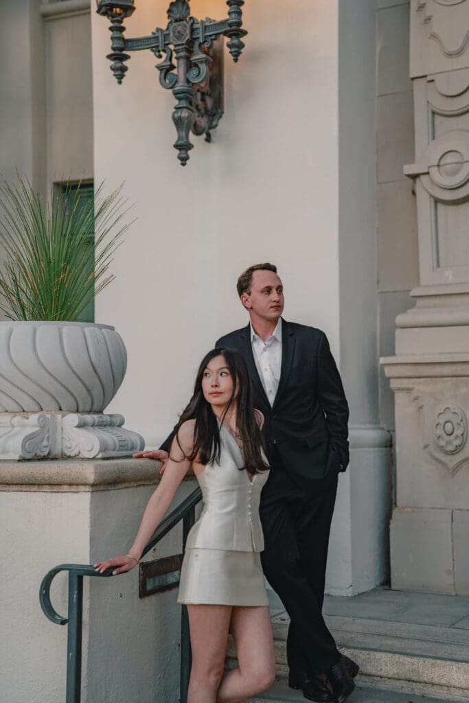 Portrait of couple on the front steps of Beverly Hills City Hall during a Beverly Hills engagement session
