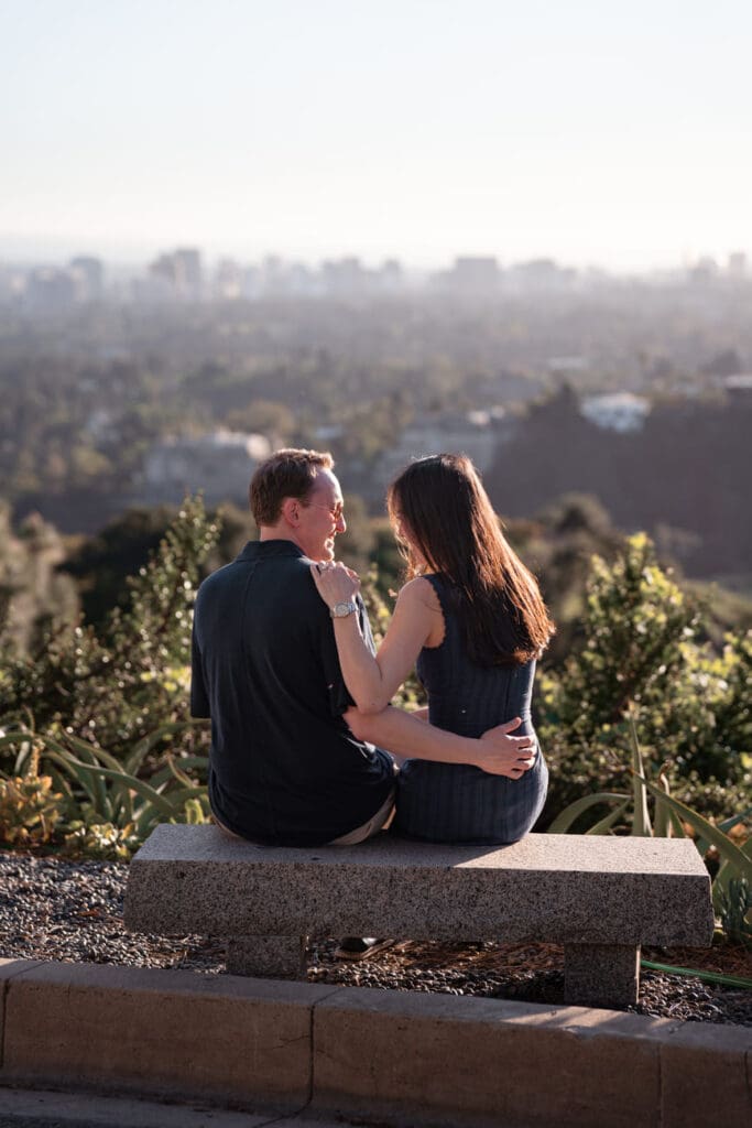 Couple walking together along a hillside path in Trousdale Estates during a Beverly Hills engagement session