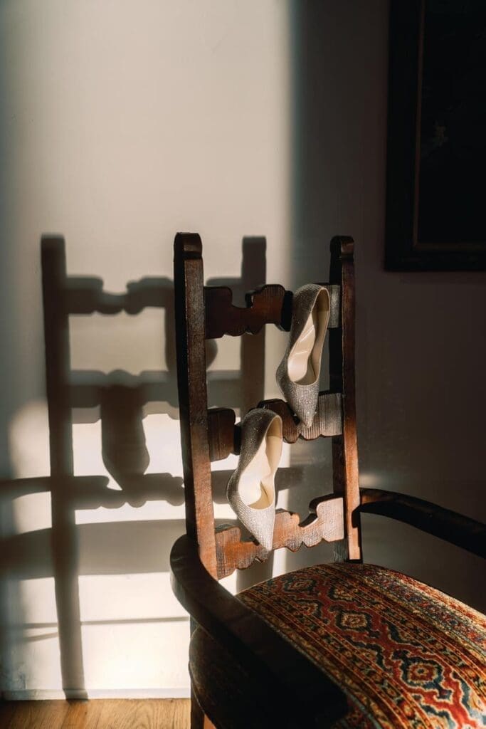 Detail photo of a chair and soft shadows inside the bridal suite at Casa Romantica in San Clemente.